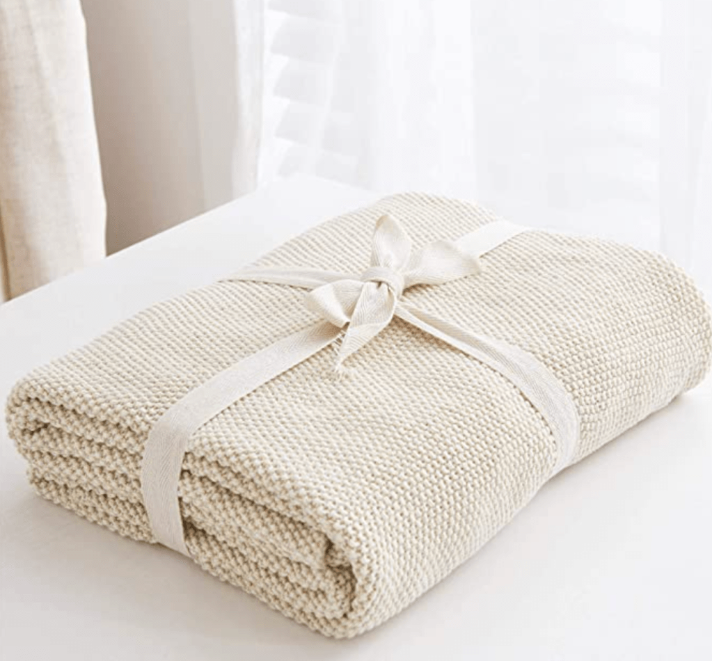 White cotton cable knit throw blanket