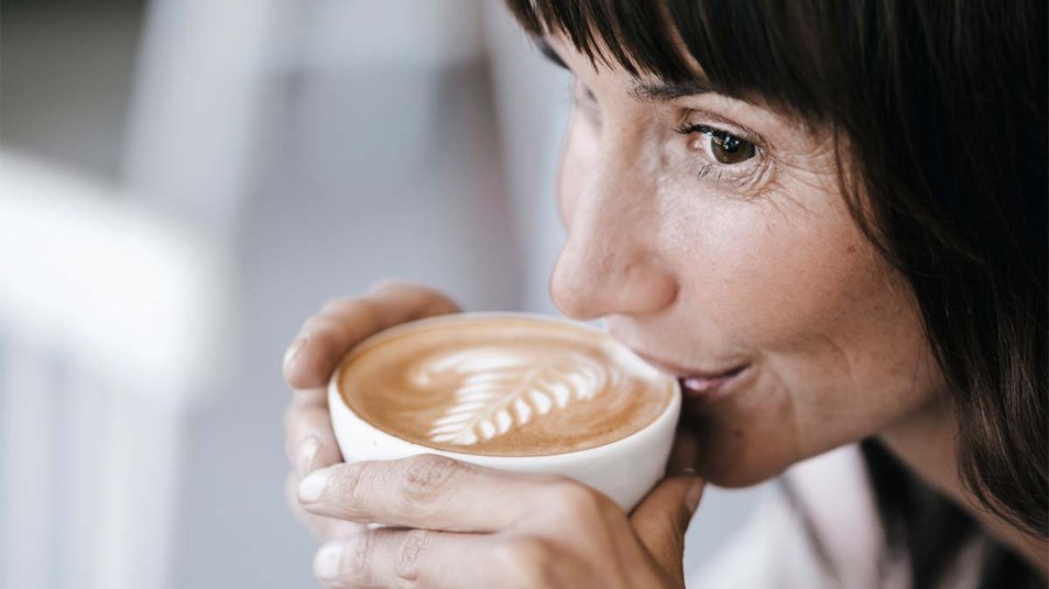 Woman drinking a latte
