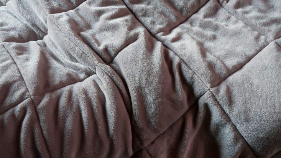 close up of a gray weighted blanket