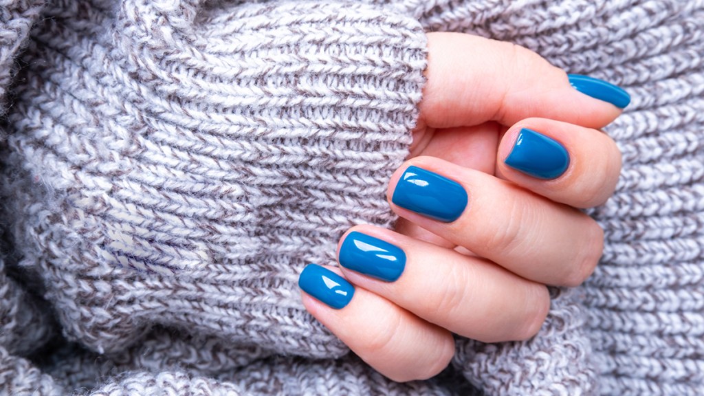 A closeup of nails painted blue
