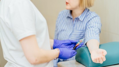 mature woman having her blood taken, test for folate