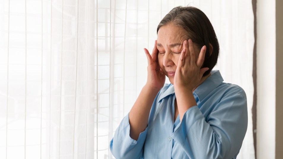 mature woman suffering from a headache