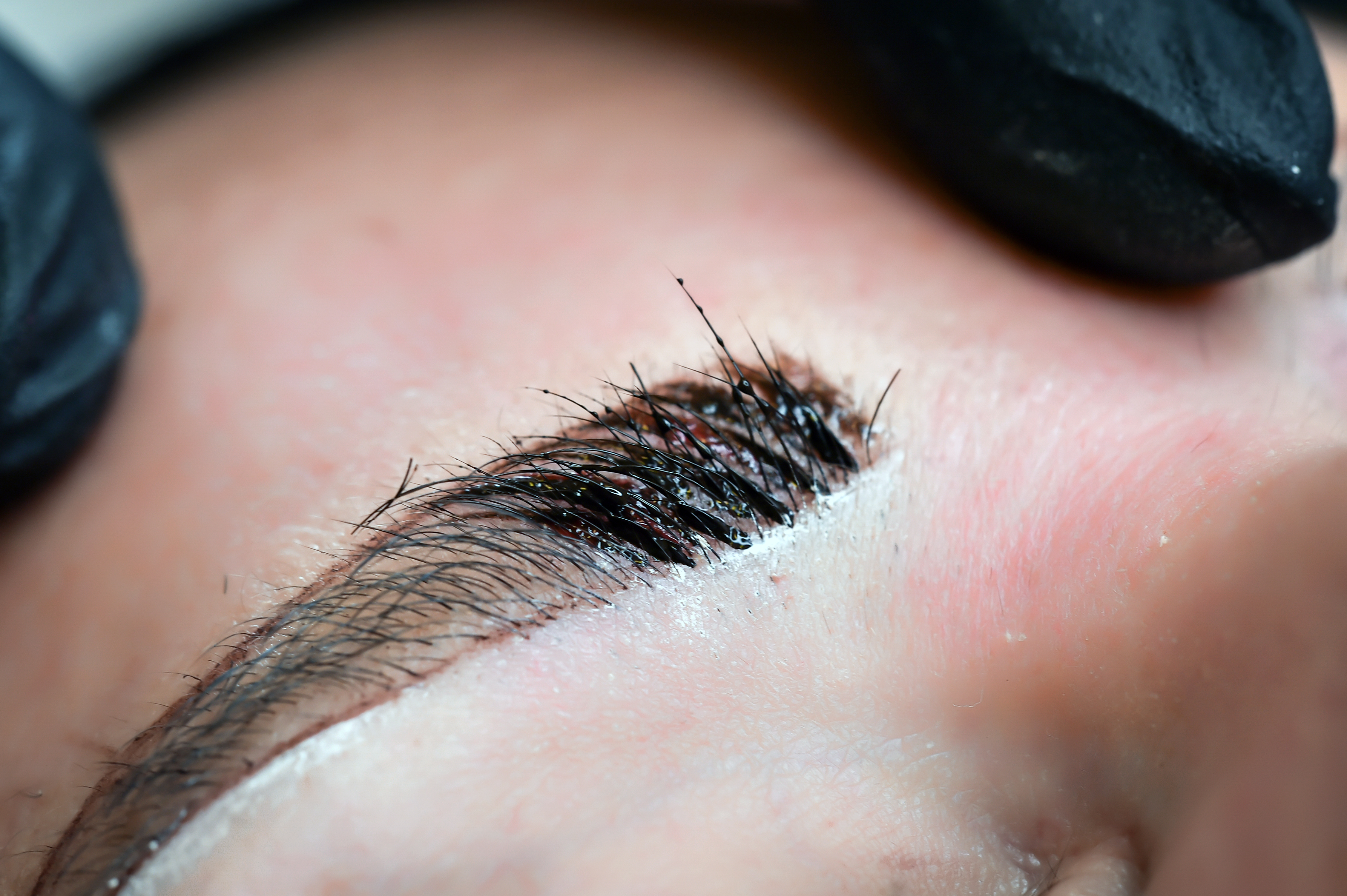 Microblading of eyebrows, facial care and tattoos in the beauty salon