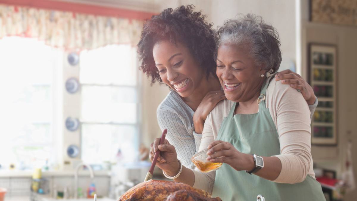 Mother and daughter cooking together