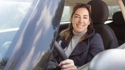 Woman sitting in a car driving