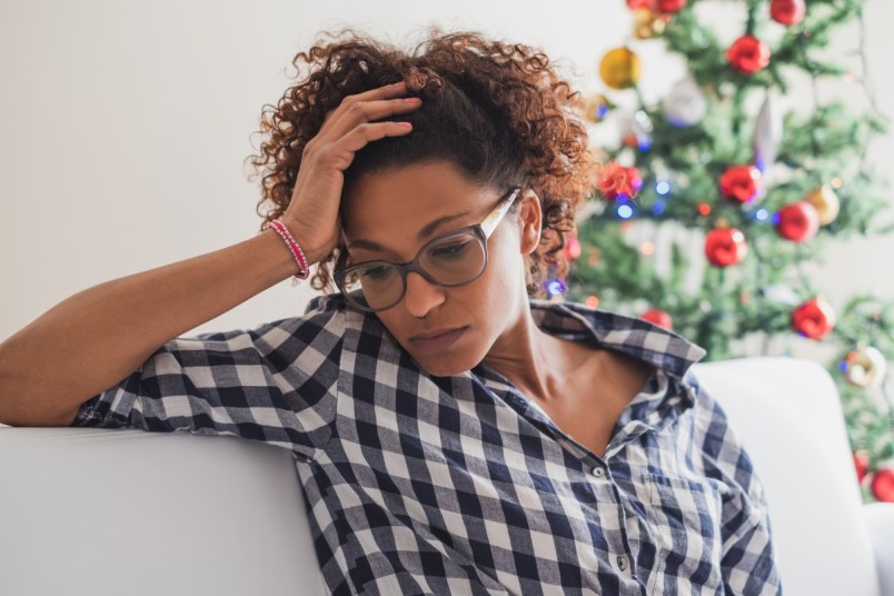 Pensive and lonely woman during Christmas