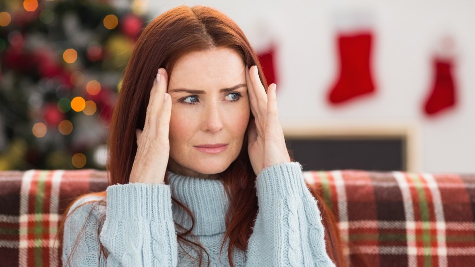 woman with a headache at christmas