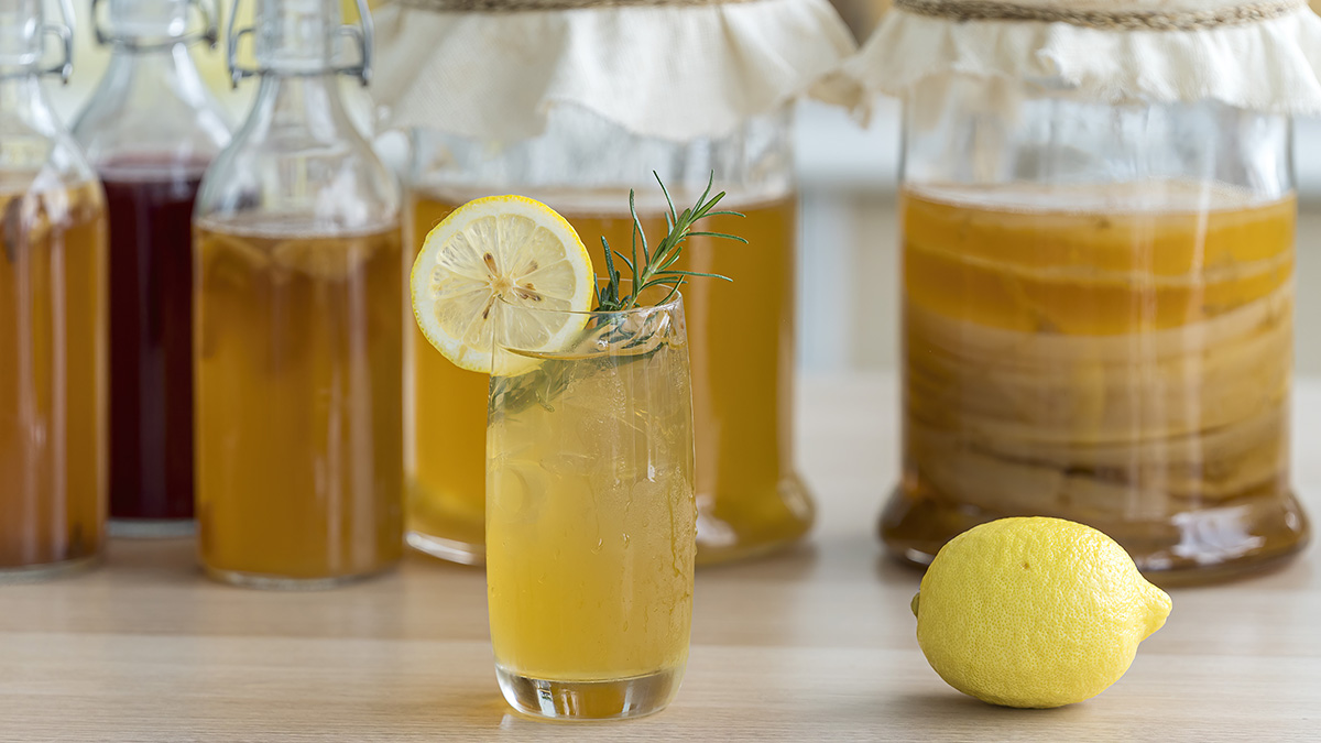 A glass of kombucha tea which can help with menopause symptoms including gas