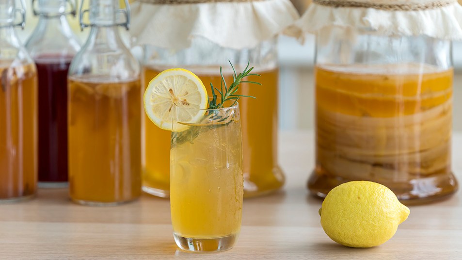 A glass of kombucha tea which can help with menopause symptoms including gas