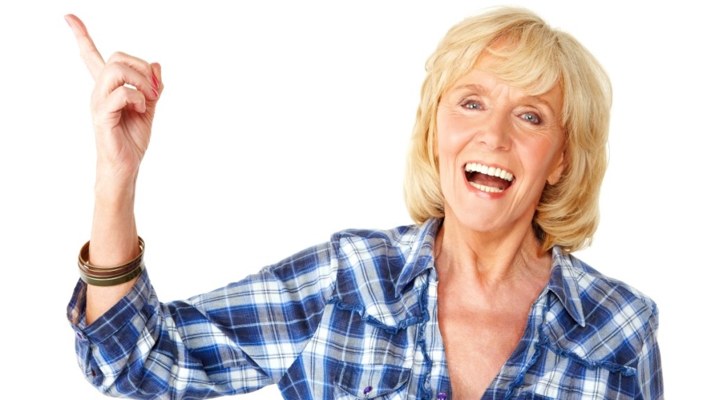 A blonde woman in a blue plaid shirt pointing off to the side to strengthen her memory
