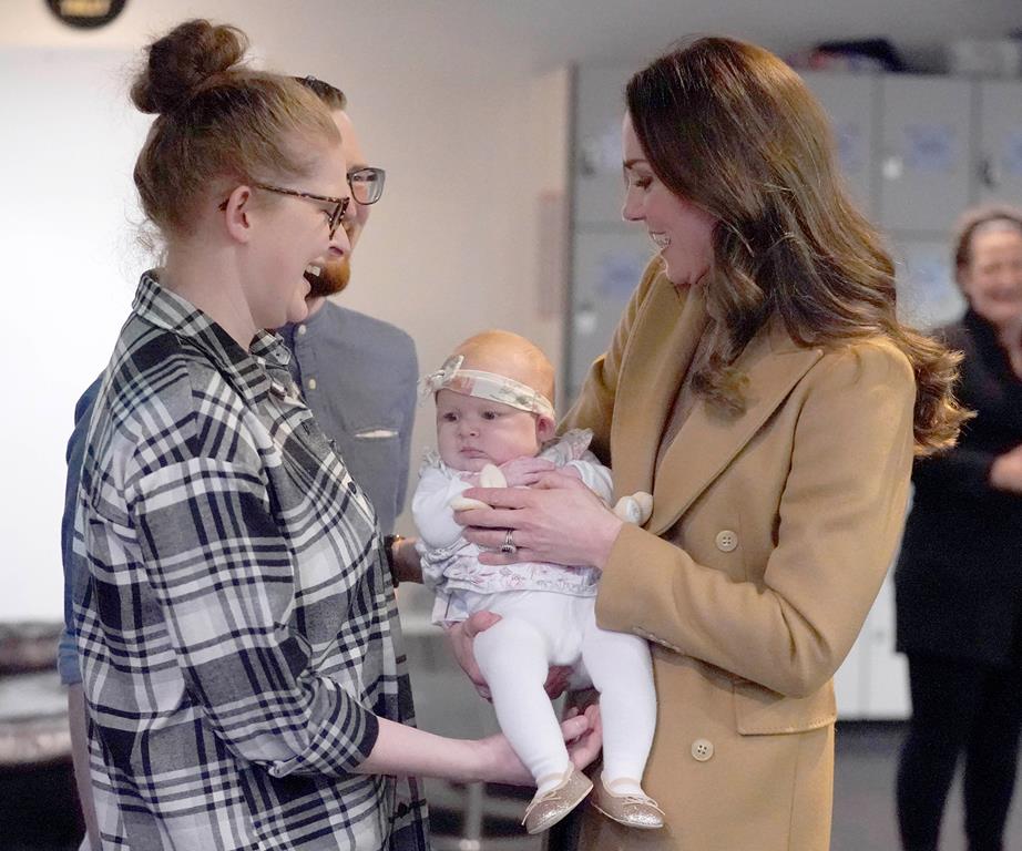 Kate Middleton holding a baby