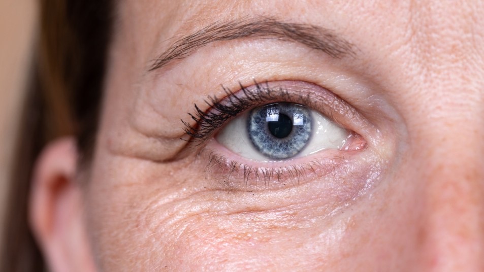 close up of mature woman with hooded eyes