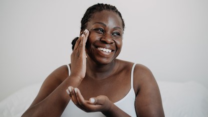 Black woman doing skincare treatment