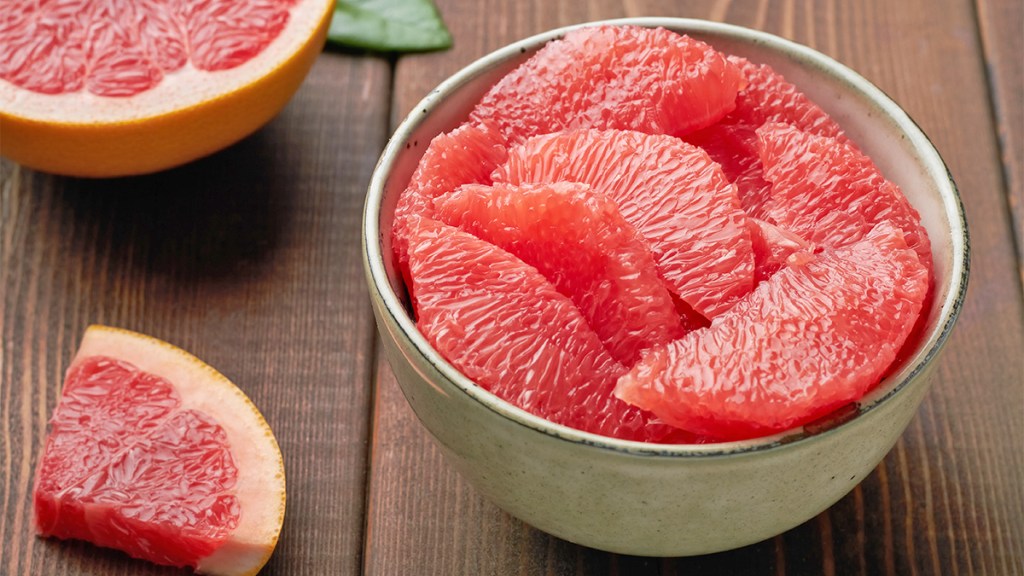 A segmented grapefruit as part of a guide explaining why the fruit is bitter
