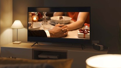 Romantic comedy movie streaming on TV and living room interior