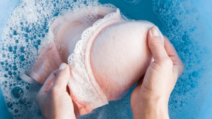 Woman's hands washing bra