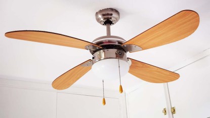 A ceiling fan hanging in a room