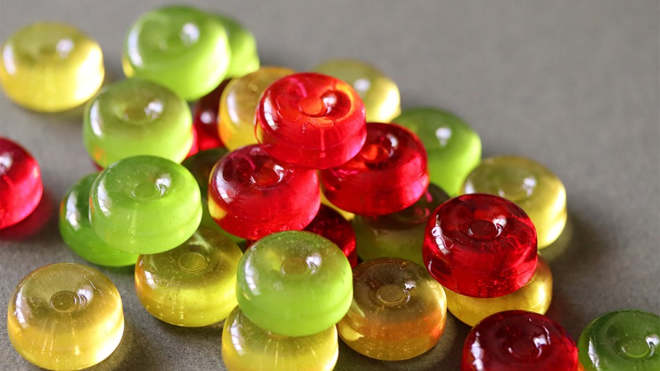 Hard candies against a gray background