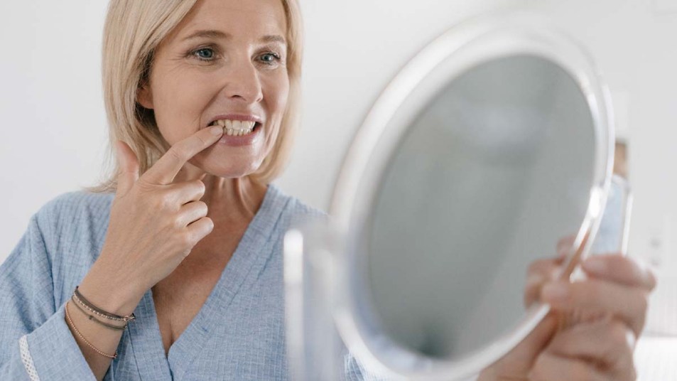 Woman looking at her teeth