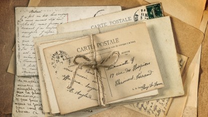 old letters and antique french postcards. vintage sentimental background retro style