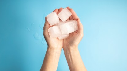 Woman's hands holding ice cubes