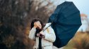 Woman with Broken Umbrella Walking in a Storm