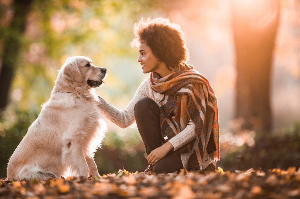 Woman outside with Golden Retriever