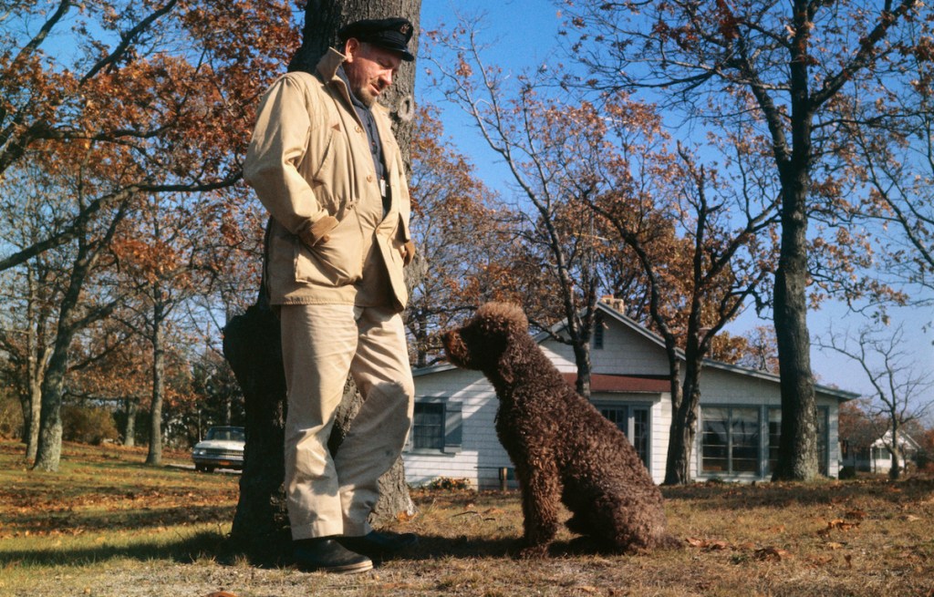 Writer John Steinbeck with his dog, Charley, in 1962