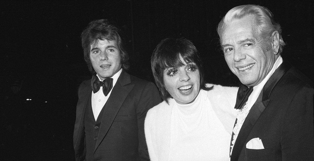 American entertainer Liza Minelli attends an unidentified formal event with date American actor Desi Arnaz Jr. (left) and his father, Cuban-born American actor and musician Desi Arnaz