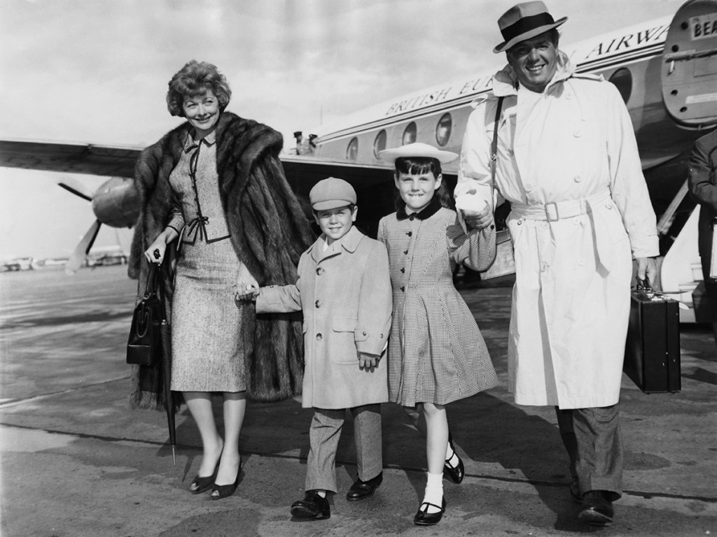American actress Lucille Ball and her husband Desi Arnaz arrive at London Airport with their children Lucie and Desi Jr., 10th June 1959. 