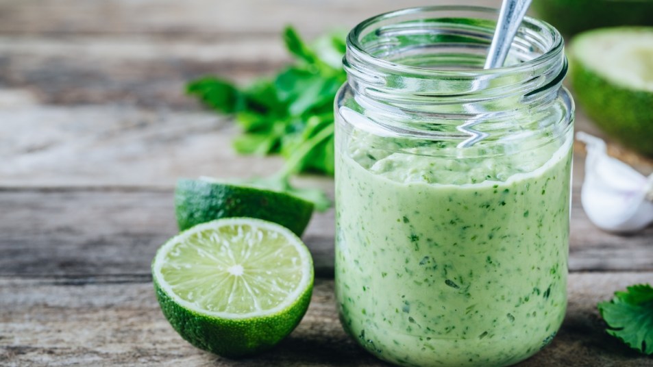 light green creamy cilantro dressing in glass jar