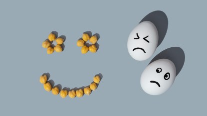 Chickpeas in a smiley face shape next to eggs with sad faces drawn on them
