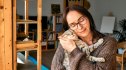 Woman cuddling cat