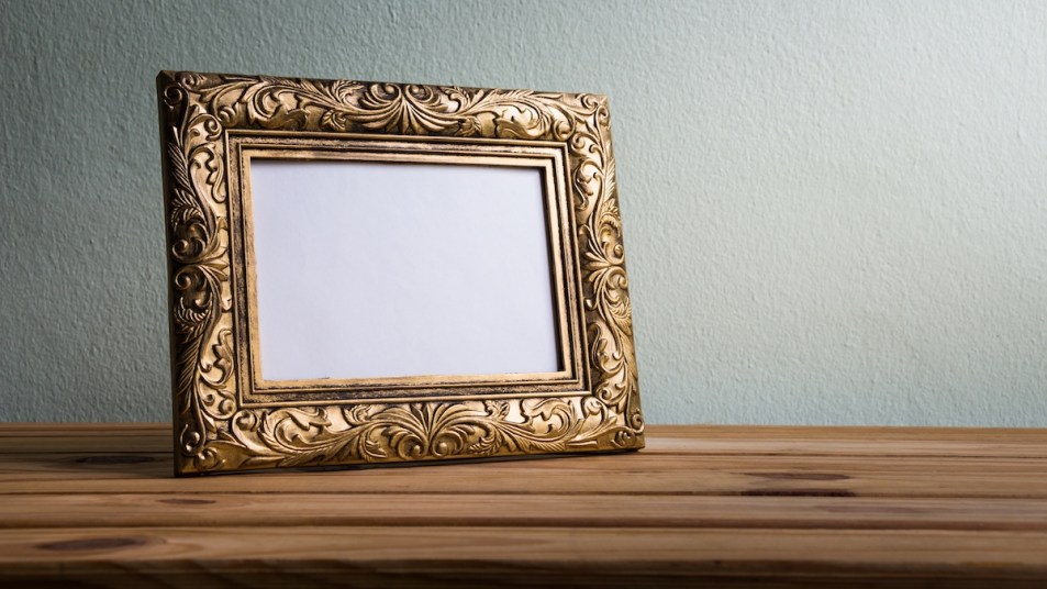 Antique picture frame on table