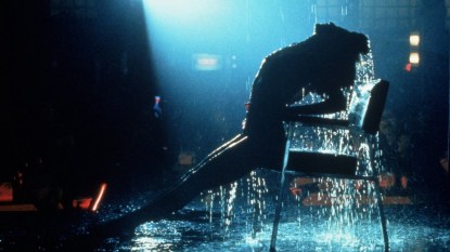 Jennifer Beals posing in shadows with water during strip routine in Flashdance