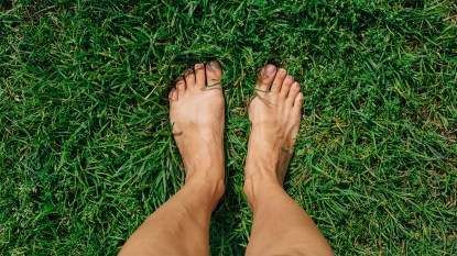 Woman barefoot in grass