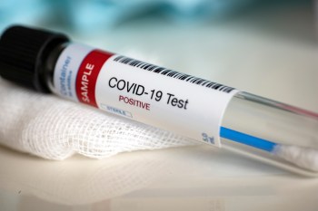 Tube containing a swab sample that has tested positive for COVID-19