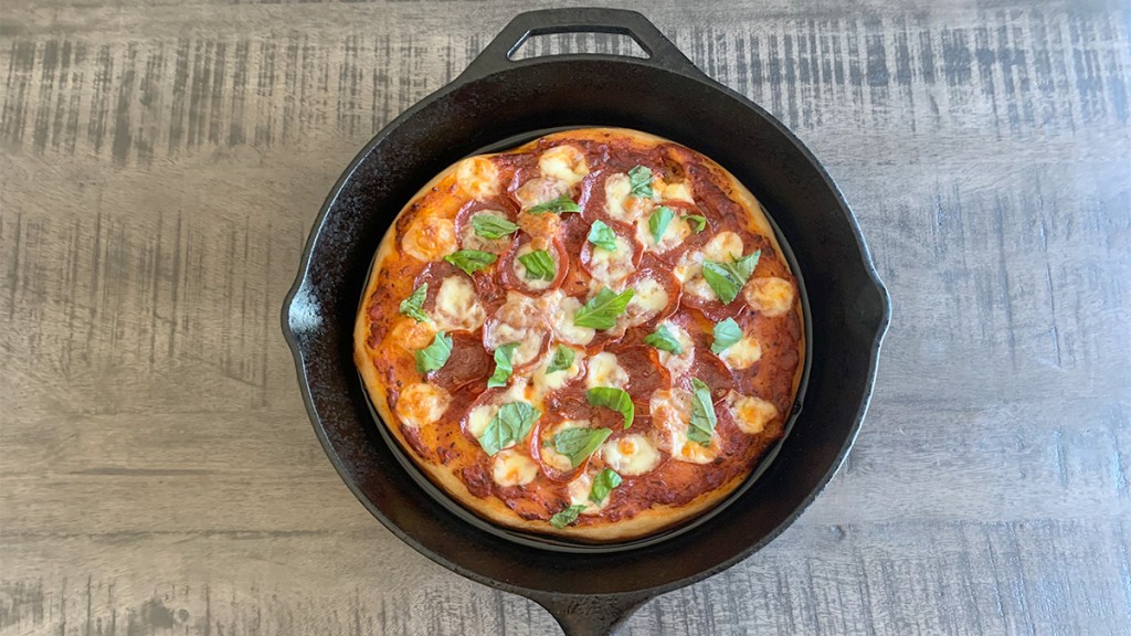 Cast iron skillet pizza fresh out of the oven