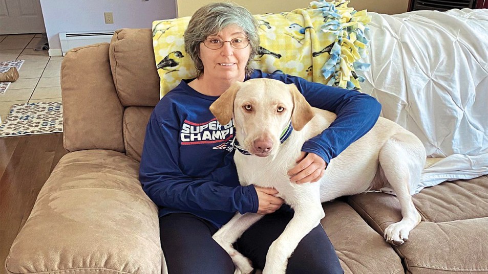 Linda Allsop, retired Army vet who has a damaged back and ankle, with her Hero Pup, Krista