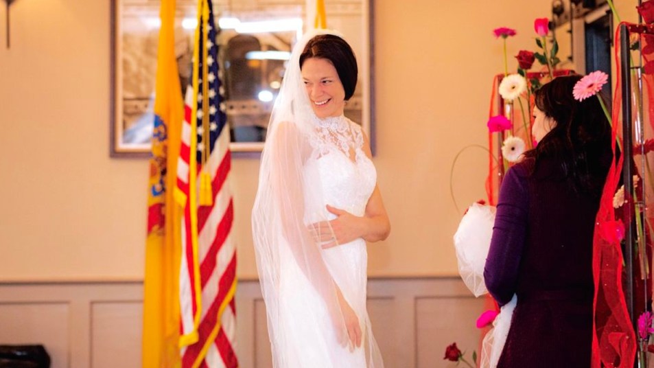 Military bride in wedding dress at Camden County dress giveaway event