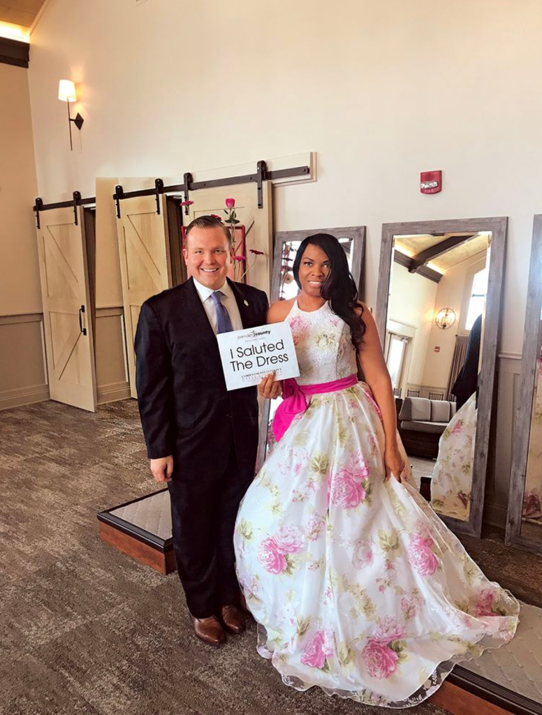 Bill Moen with military bride at Camden County wedding dress event