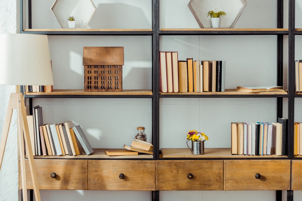 Close,Up,Of,Wooden,Rack,With,Books,In,Living,Room