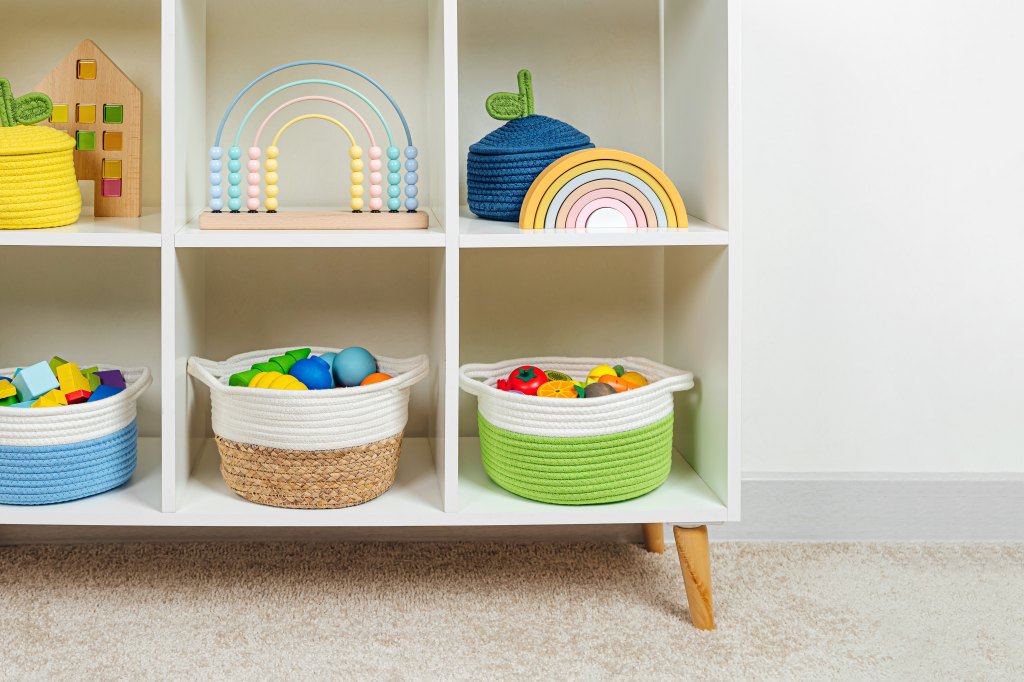 Colorful,Storage,Baskets,On,Shelves.,White,Shelving,With,Rainbow,Wooden