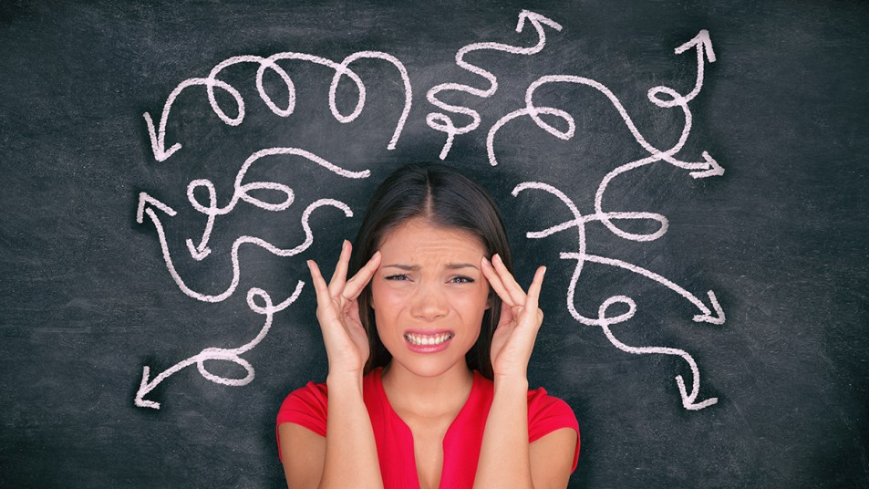 Woman with her stressed thoughts played out on a blackboard
