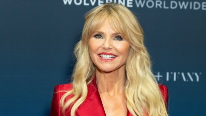 close up of model christie brinkley in red