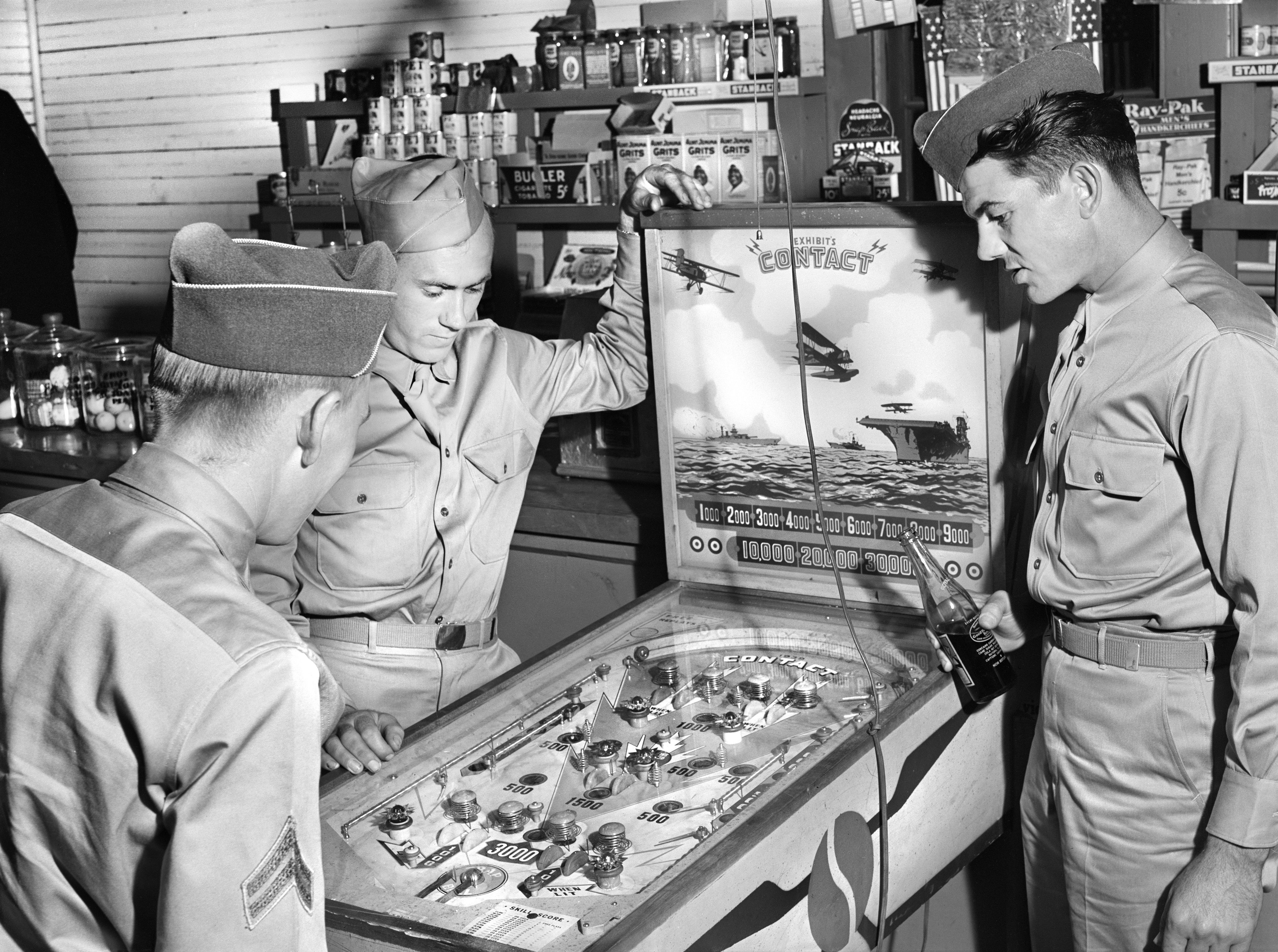 Soldiers playing pinball in 1941