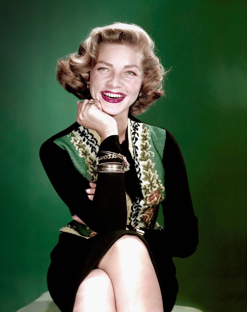 Bacall is all smiles as she shows off her pin curls (1953)