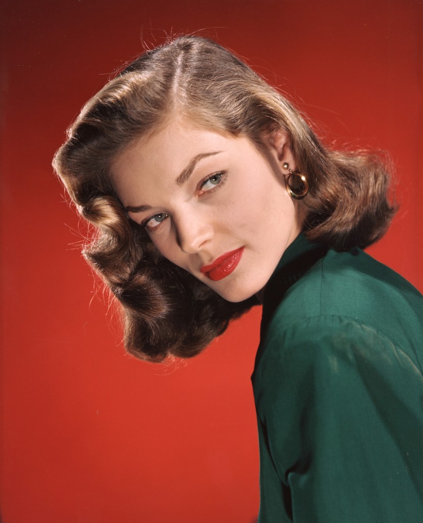Bacall's pin curls look good from any angle (1945)
