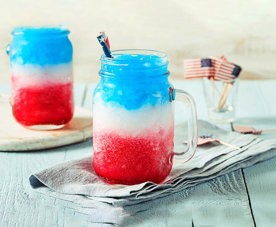 Homemade Patriotic Red White and Blue Slushie Cocktail in a Mason jar