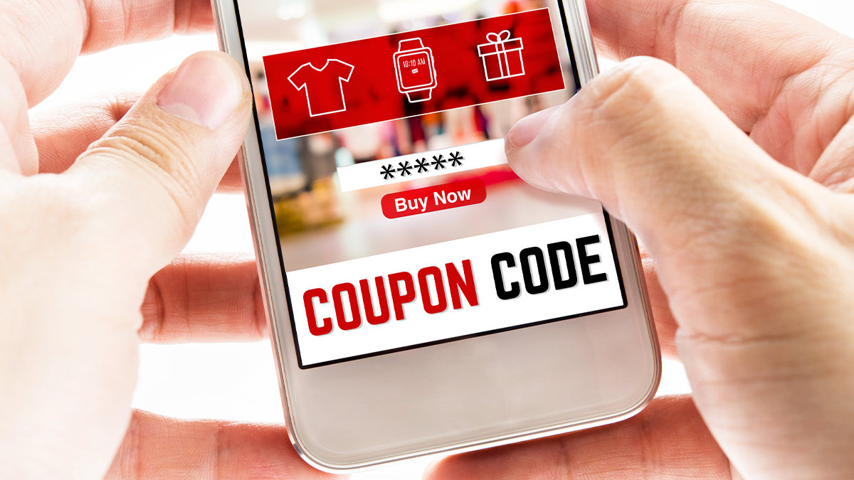 hand holding a phone with coupon code